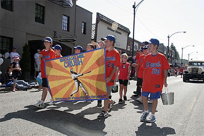 Crush players parade at Railroad Days. The team ran a food drive this summer to help the Mount Si Helping Hand Food Bank. Groups went door to door on Snoqualmie Ridge and collected more than 1