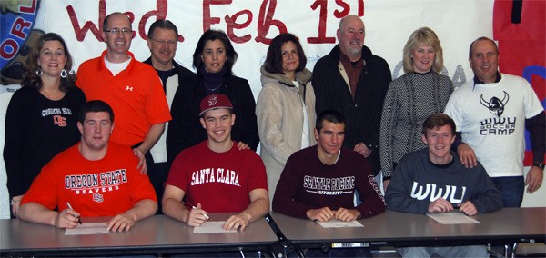 Parents gather behind Mount Si collegiate-athletes-to-be. From left are: Josh Mitchell