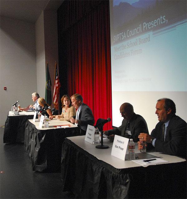 Hopefuls for three Snoqualmie Valley School District board positions prepare for a rapid-fire question session Thursday