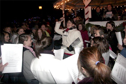 Choral leader Kim Snavely rouses the Mount Si High School choir during a holiday performance Thursday