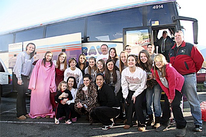 The Mount Si volleyball team says goodbye to family members as their bus prepares to leave for the state tournament. Mount Si took sixth place.