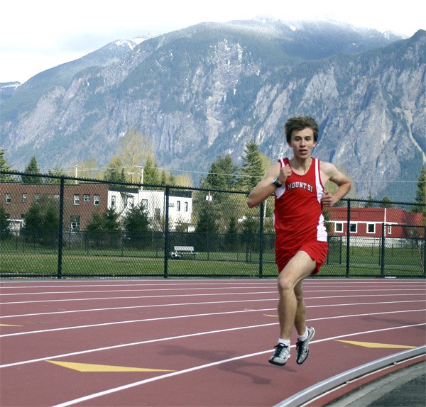 Mount Si sophomore Dominick Canady claims the lead in the mile race Thursday