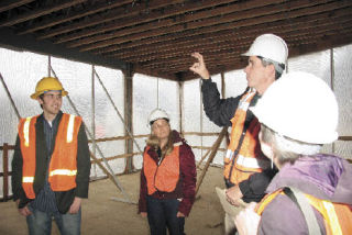 Snoqualmie Mayor Matt Larson shows the town’s new city hall to urban planning students from the University of Washington. The new city hall utilizes green technology and has a flexible design