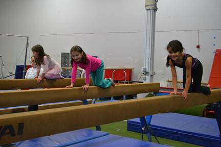 Children explore the balance beam at Puget Sound Gymnastics and Dance’s new location at the Preston industrial park.The new site has more space