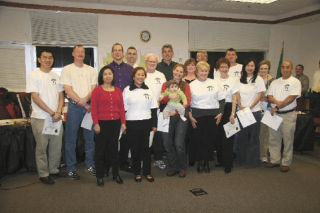 Members of the Snoqualmie Citizens Academy’s second-ever “graduating class” receive congratulations and a diploma from city officials on the evening of Monday