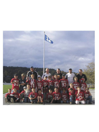 Huddling beneath the Seattle Seahawks’ 12th fan flag