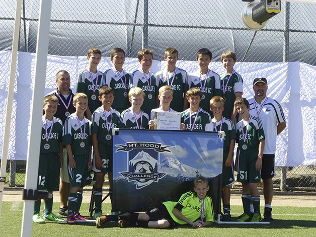 Local soccer team, CFC's U-13 Boys, hold the Hood Challenge trophy
