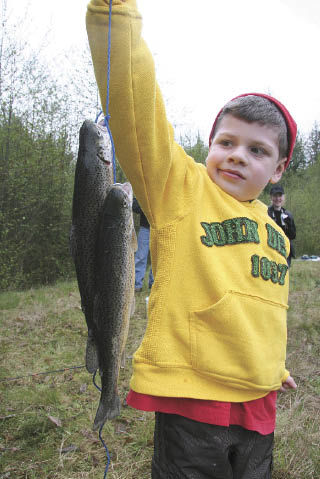 A young fisherman holds up a few beauties caught in the 2008 Mount Si Fish and Game Club Children’s Trout Derby. This year’s event takes place Saturday