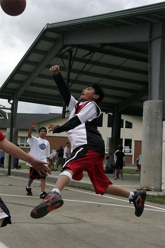 Youths play basketball during Fall City Days. The new three Point Shoot-out basketball contest is noon to 2 p.m. Saturday