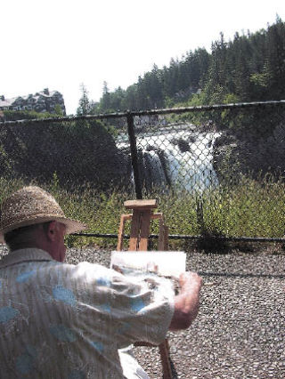 Snoqualmie Arts Commission member Jeff Waters paints the Snoqualmie Falls during a painting session with other artists