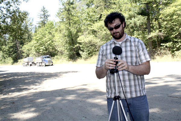 Consultant Matt Roe of SSA Acoustics of Seattle installs a sound level meter on the boundary of the Old Mill Adventure Park near Snoqualmie. The tests will measure noise from DirtFish rally school