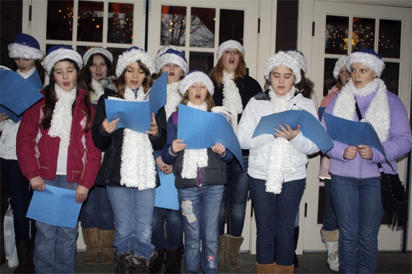 Members of the Snoqualmie Valley Youth Choir sing carols at the Nov. 27 tree lighting at Salish Lodge and Spa.