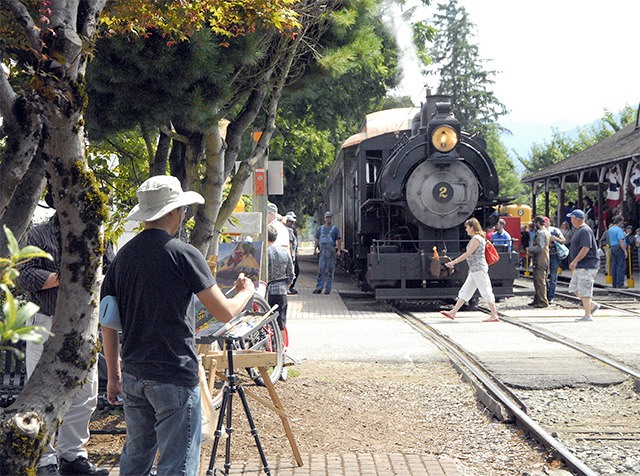 Redmond artist Roy Tan paints a scene with the Snoqualmie Depot during the 2014 Plein Air Paint Out.