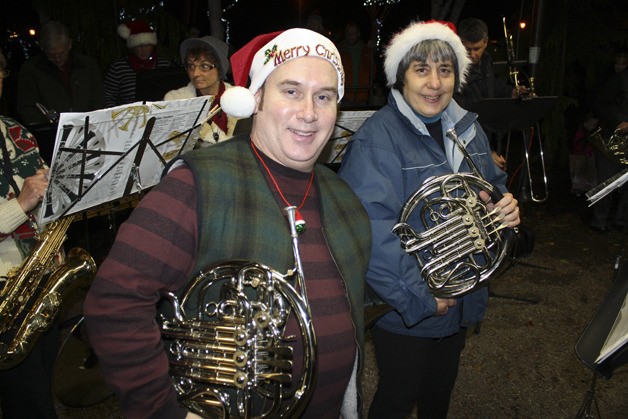 Brian Knowles and Mary Norton ready their French horns for the Valley Winds concert