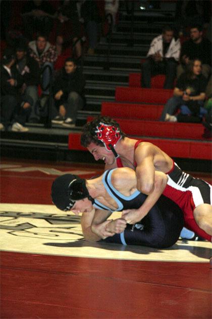 Mount Si’s Andrew Sypher tries to flatten Interlake wrestler Daniel Montoya during competition Thursday