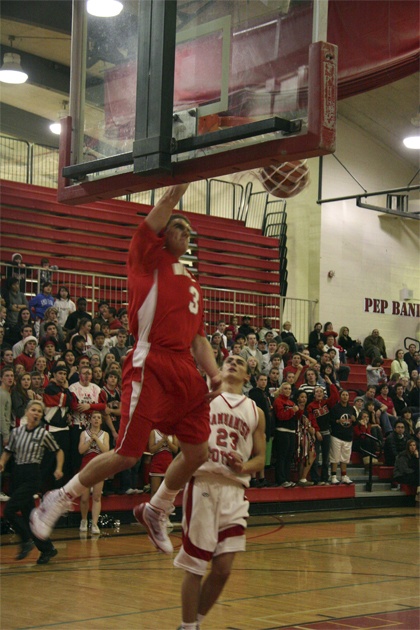 Mount Si’s Tanner Riley slams the ball during second-half action Friday evening