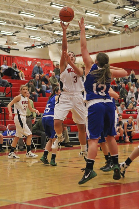 Wildcat outside shooter Molly Sellers fires off a shot during play Wednesday