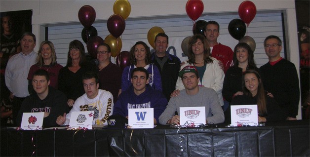 They're officially bound for college play: Celebrating with family Wednesday morning