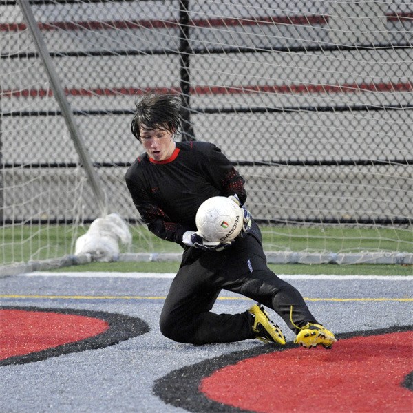 Mount Si sophomore Alex Anderson blocks a shot Friday