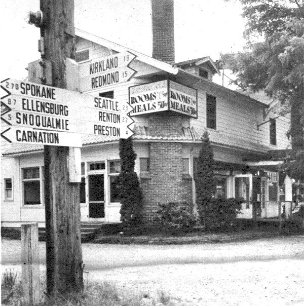 Signposts at the Riverside Lodge in Fall City show travelers the way in 1950.