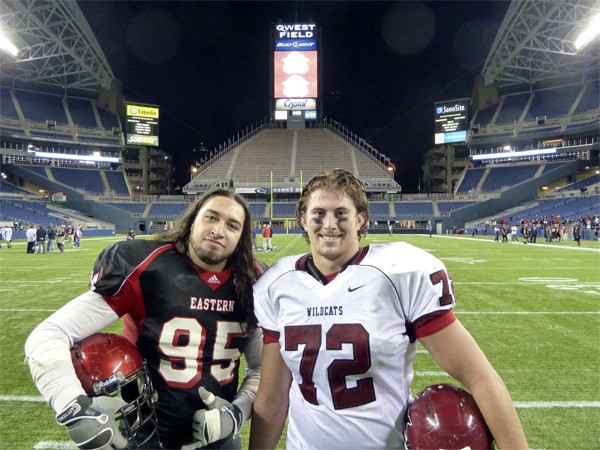 Michael Nelson and Charles Moetului meet during the “Showdown on the Sound' game at Seattle's Quest Field.