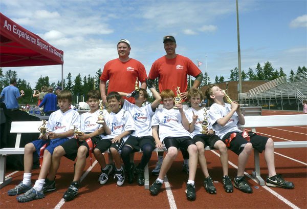 Holding their trophies