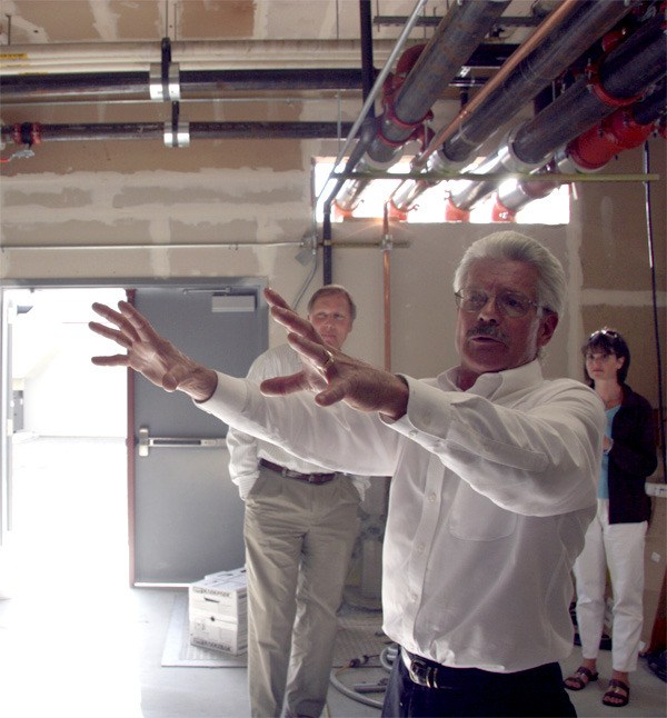 Facilities Director Clint Marsh gives school board members a tour of remodeled utility areas at Mount Si High School.