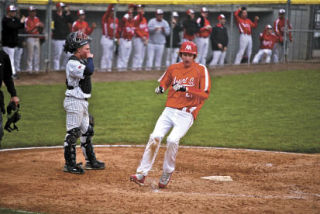 Taylor Campbell crosses home plate