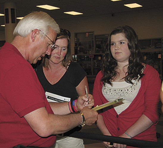 Freshman Halle Parker meets with Mount Si High School principal Randy Taylor during Wildcat Days on Tuesday