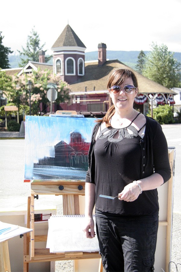 Stephanie Christensen works on her take on the 120-year-old Snoqualmie Depot during the Plein Air Paint Out