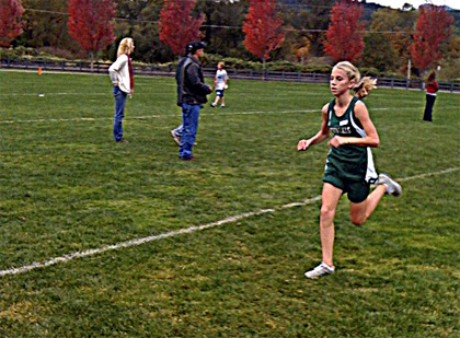 Eighth grade runner Bailey Scott fires from the starting line during cross country finals Oct. 20 at Lake Sammamish.