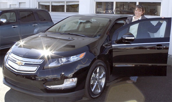 Michelle Protzman of Chaplins Chevrolet inspects a 2011 Volt