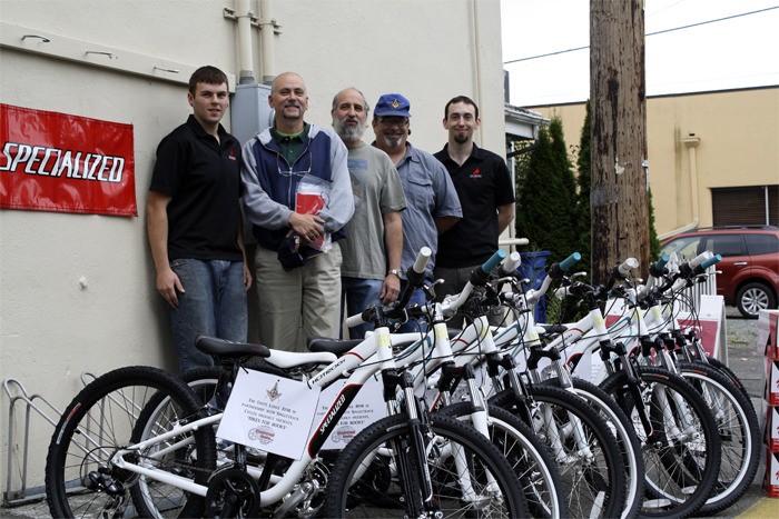 Gathering new bikes for distribution to Valley schools for the Unity Masons' Bikes for Books program are