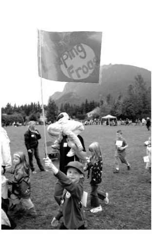 Sawyer Romano waves his class flag at Opstad Elementary’s walk-a-thon fundraiser