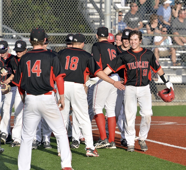 Justin Lutz celebrates his home run — one of five for Mount Si scored April 18 in Redmond with teammates. Photo courtesy of Calder Productions