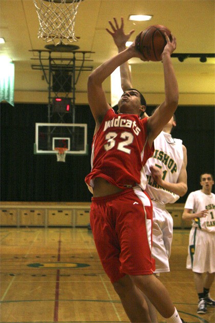 Mount Si sophomore Anthony McLaughlin jumps for a dunk in play Saturday