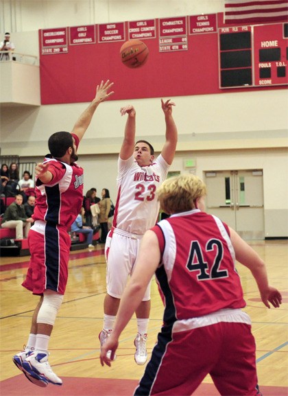 Mount Si’s Jordan Karavias attempts a basket during play Friday