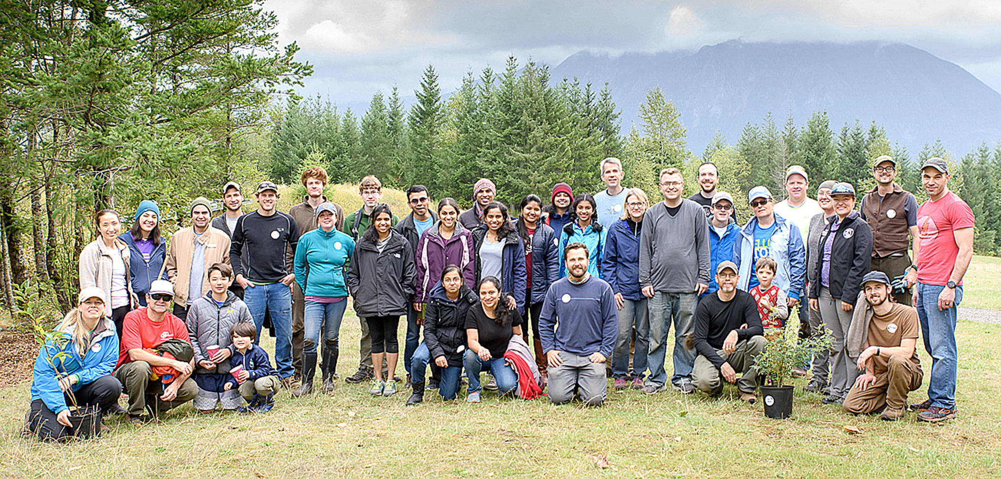 Some 60 community volunteers helping to remove invasive plants and plant native species at Snoqualmie Point Park and the Meadowbrook Slough at the city’s first ever Green Snoqualmie Day, Oct. 7, take a break for a group photo. (Photo courtesy of Jim Avery)