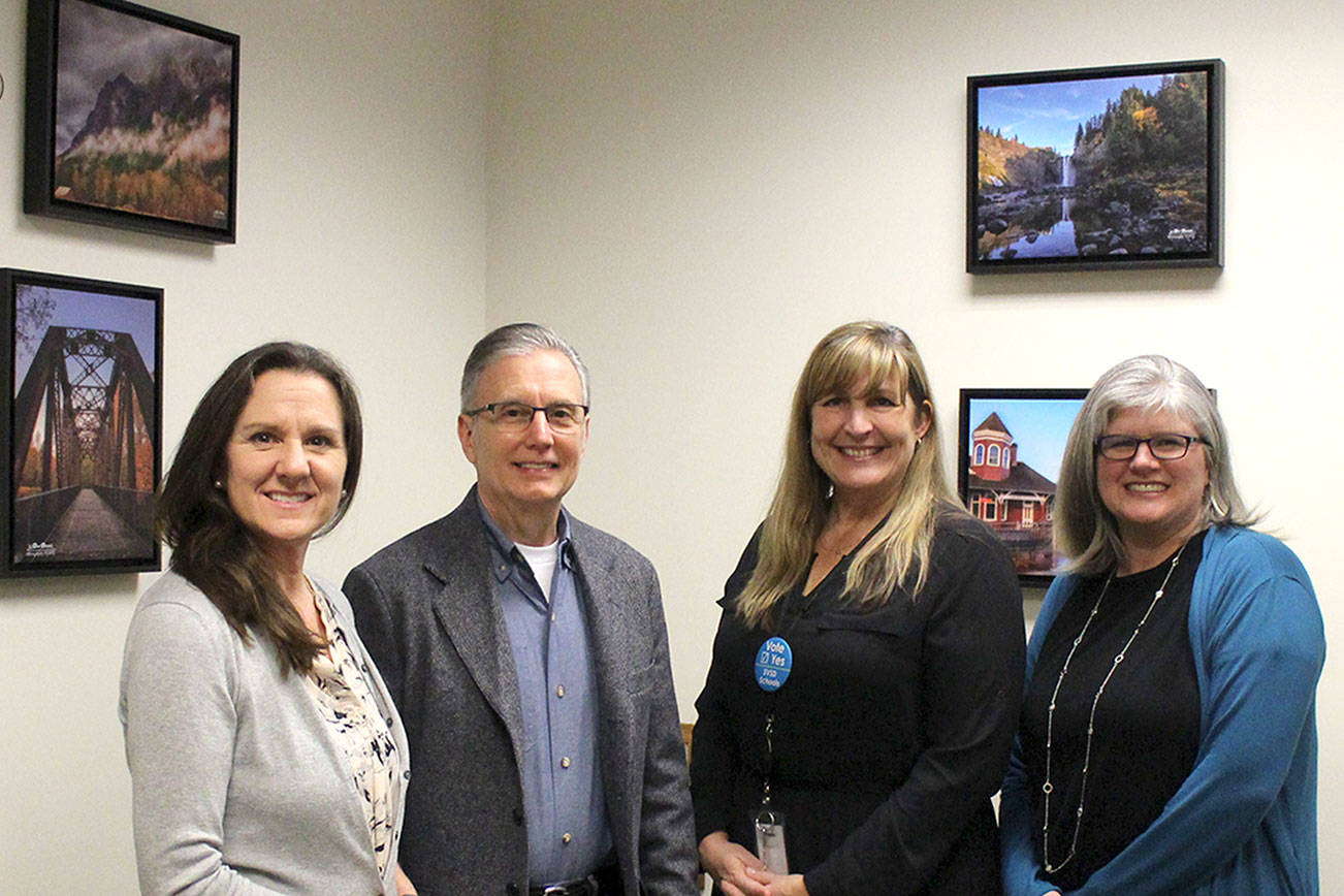 PTSA board, photographer Don Detrick, partner to decorate Snoqualmie Elementary School office