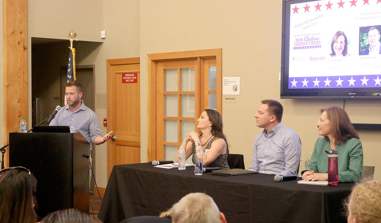 Nate Perea moderated the forum and asked the candidates questions on seven topics throughout the night. Evan Pappas/staff photo