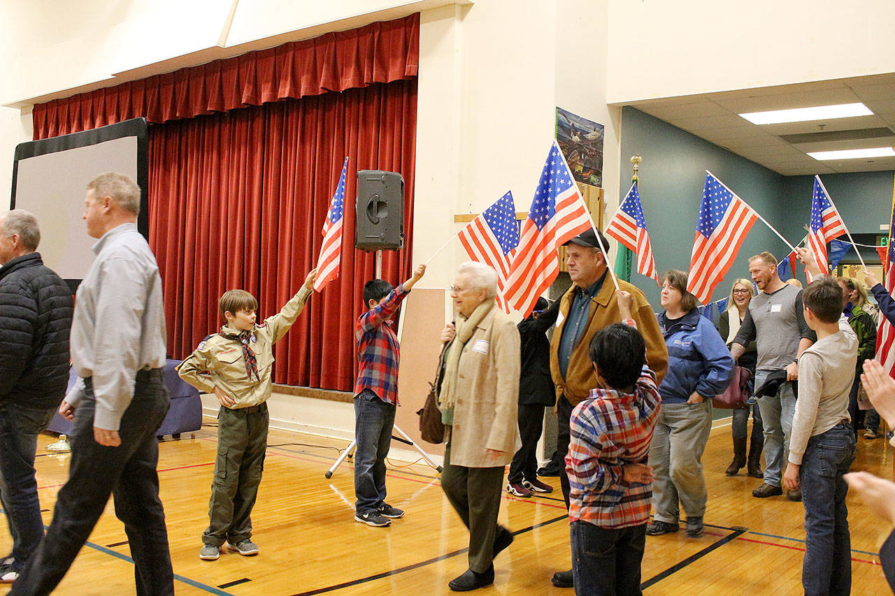 Peter Gabryjelski and other fourth-grade students from Ms. Cuddihy’s class welcome veterans as they enter the Snoqualmie Elementary Veterans Day assembly on Nov. 9. Madison Miller/staff photo