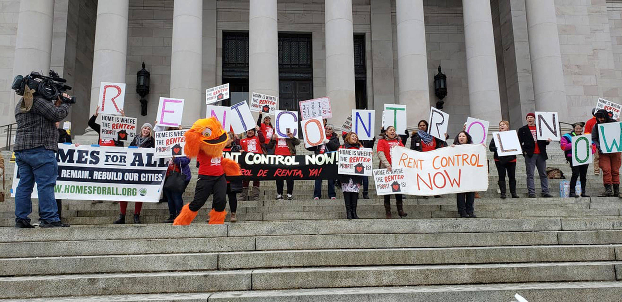 Advocates hold a rent control rally in Olympia on Feb. 27, the day before Oregon passed legislation capping rent increases and prohibiting no-cause evictions. Photo courtesy of Amy Tower/Tenants Union of Washington State