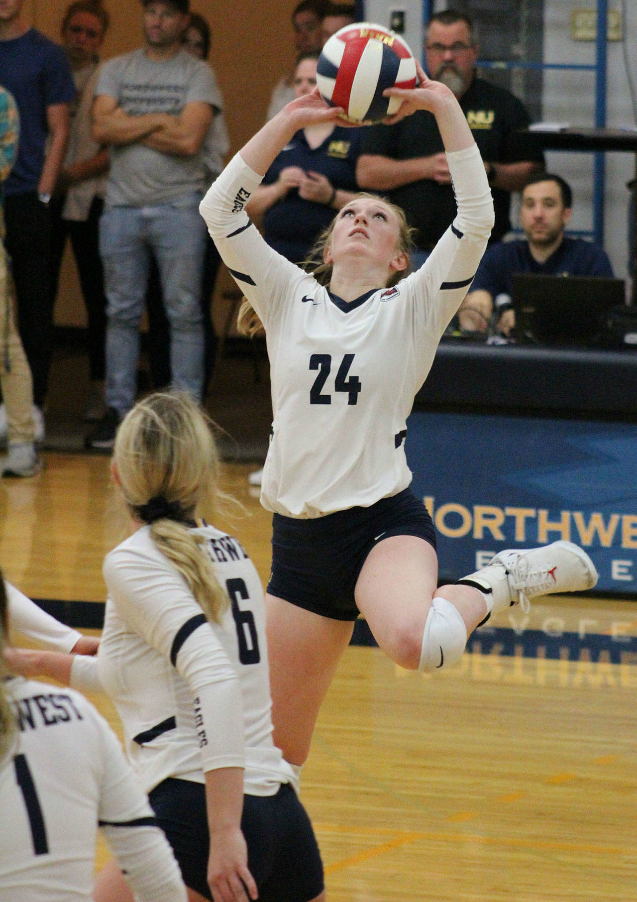 Mount Si graduate Courteney Carr delivers a set for the Northwest University squad. Photo courtesy of Northwest University