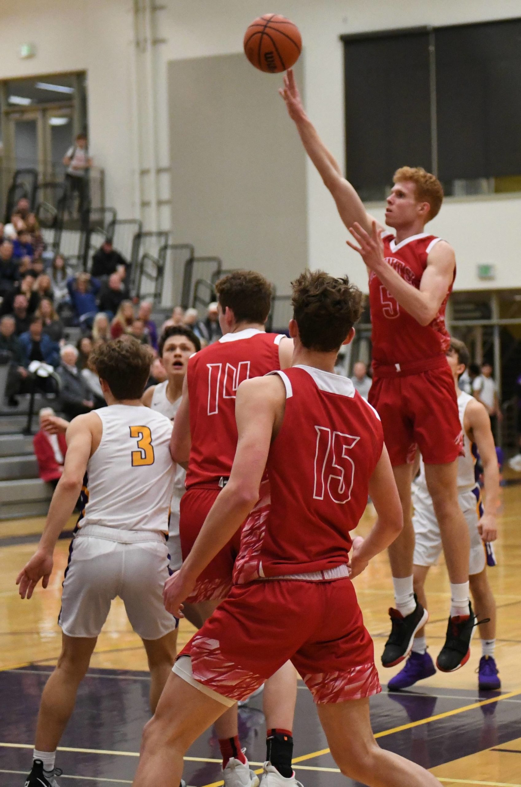 Mount Si’s Jabe Mullins rises above the pack for a shot against Issaquah on Jan. 7. The Wildcats won, 53-39. Mullins led the Wildcats with 18 points. Mount Si (10-3 overall at press time) raised its league record to 7-0 at press time following wins over Woodinville, 58-44, on Jan. 10 and Inglemoor, 55-46, on Jan. 11. Courtesy of Calder Productions