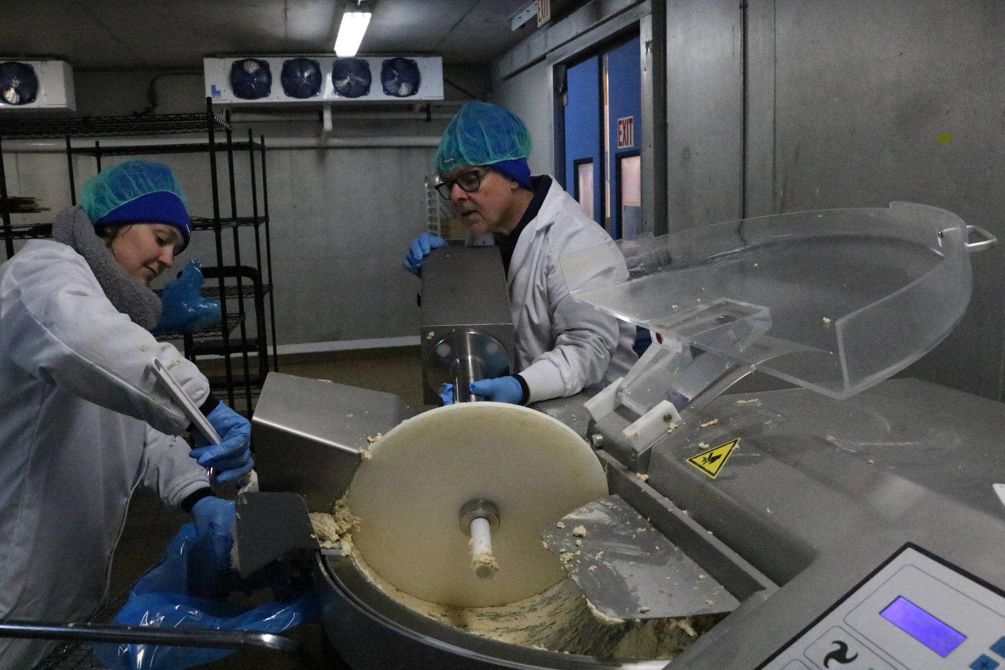 Employees at Rebellyous prepare plant-based chicken nugget dough. The company sells to commercial kitchens, and is hoping to expand in the coming year. Aaron Kunkler/staff photo