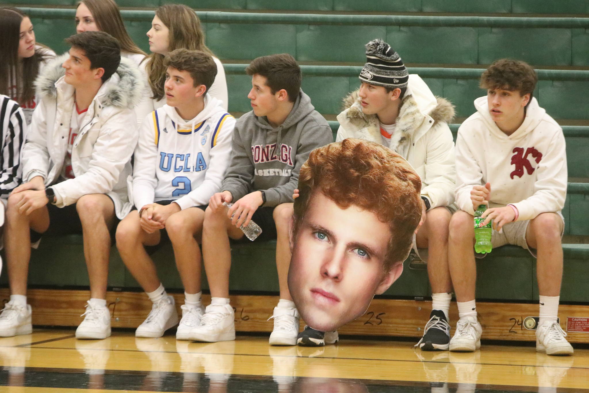 Mount Si fans prepare for the Wildcat boys game on Feb. 20 at Jackson High. One fan holds a cardboard cutout of player Jabe Mullins. Andy Nystrom/ staff photo