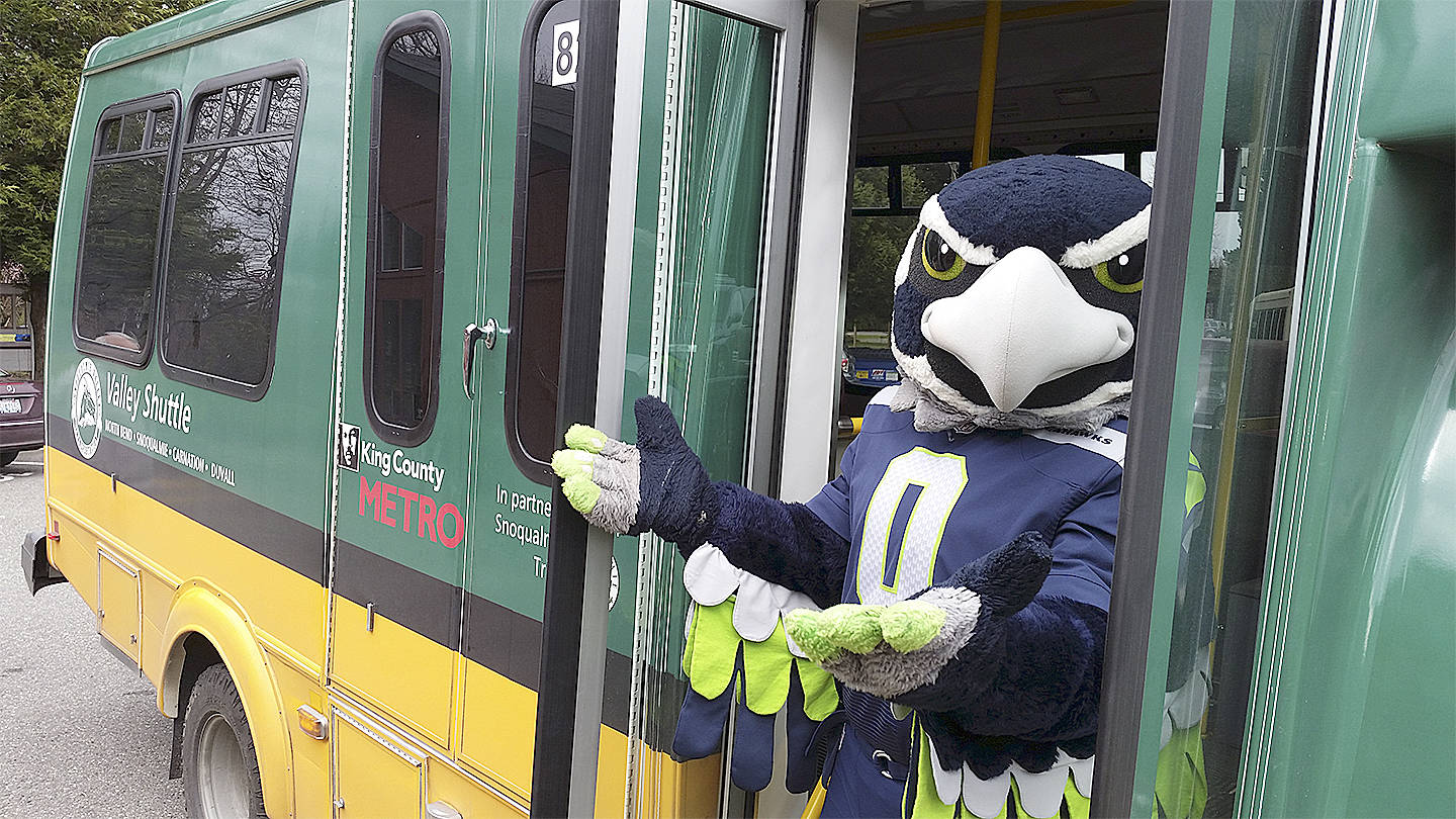 Blitz poses for a photo with a Snoqualmie Valley Transportation shuttle. File photo