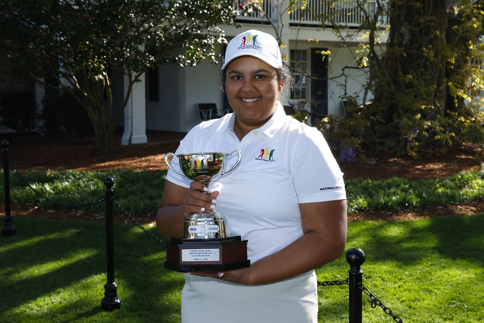 Kasey Maralack in the Girls 14-15 age group holds her trophy during the Drive, Chip and Putt National Finals at Augusta National Golf Club, Sunday, April 4, 2021. Contributed photo