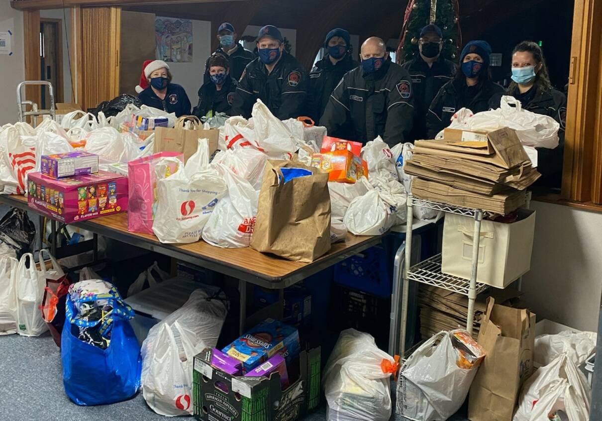 The Snoqualmie Fire and Police Department participated in the second annual Santa Parade and Food Drive to benefit the Helping Hands Ministry Backpack Program. The group provided food for over 200 kids who face food insecurity and provided gifts to 262 kids in the Valley. Courtesy photo.