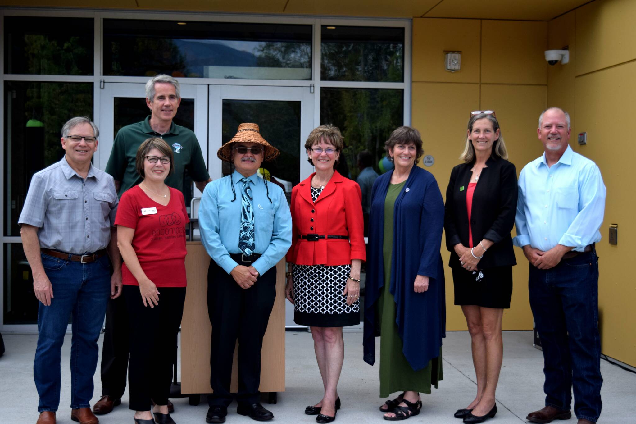 Community leaders gather outside Encompass NW’s new Child Development Center on Aug. 19 for the building’s grand opening. From left: State Rep. Bill Ramos, Snoqualmie Mayor Matt Larson (back), Encompass Executive Director Nela Cumming, Snoqualmie Tribal Chairman Robert de los Angeles, King County Councilmember Kathy Lambert, State Rep. Lisa Callan, Issaquah Mayor Mary Lou Pauly, North Bend Mayor Rob McFarland. Photo by Conor Wilson/Snoqualmie Valley Record